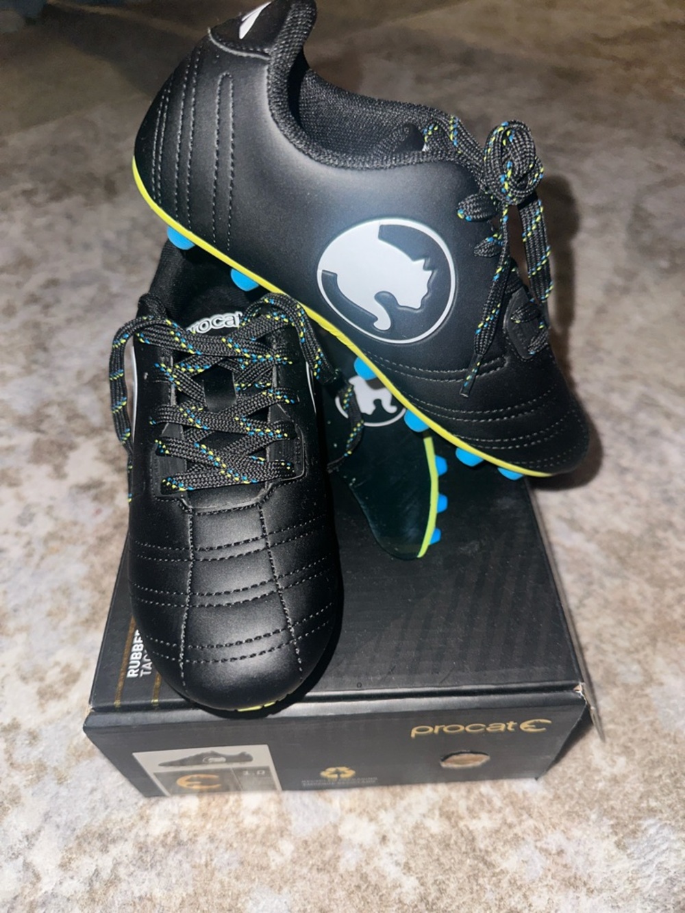 Kids Black Soccer Cleats with Neon Yellow Trim